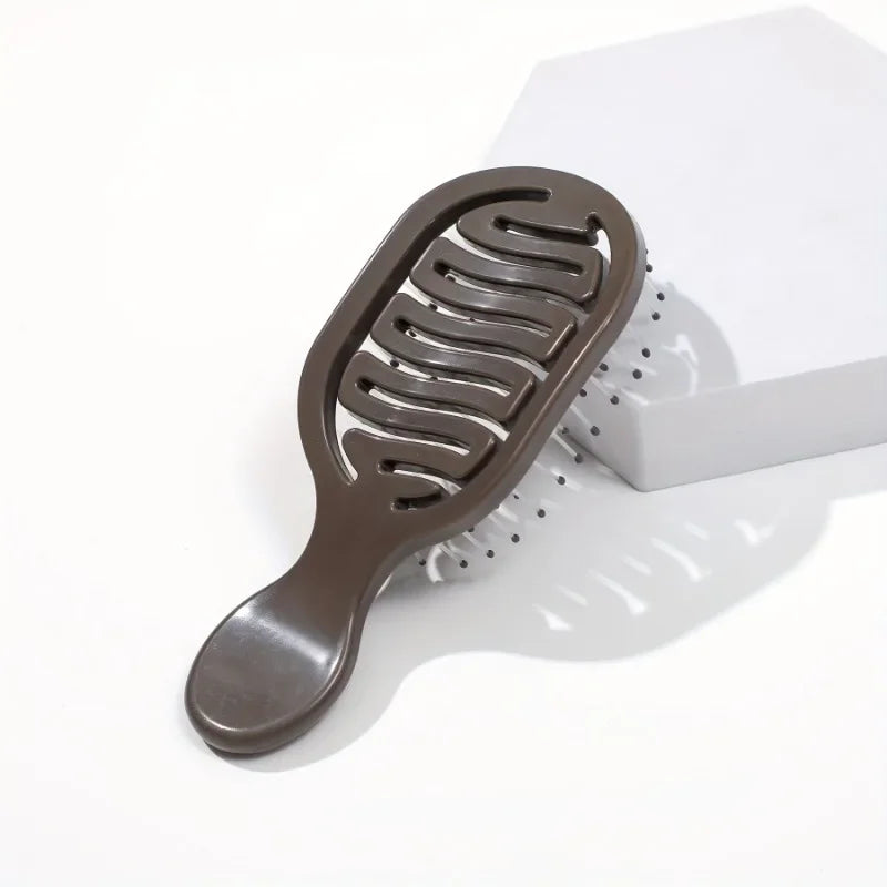 Brown Mini Travel Hair Brush on a white background