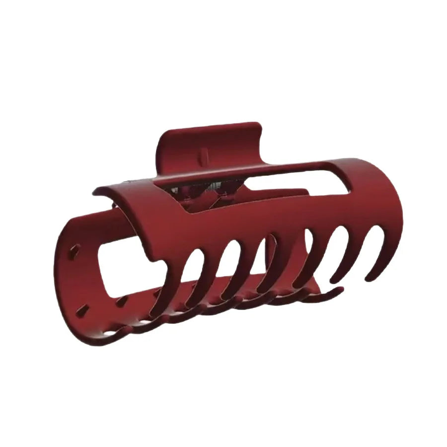 Red hair clip on a white background