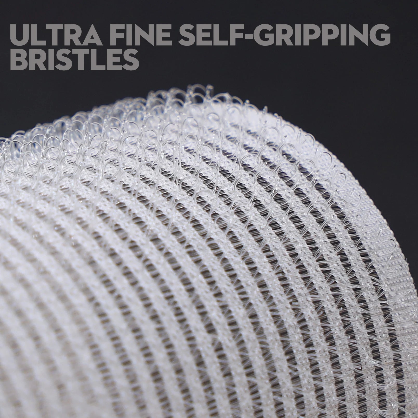Close-up of a brush with ultra fine self-gripping bristles on a black background.