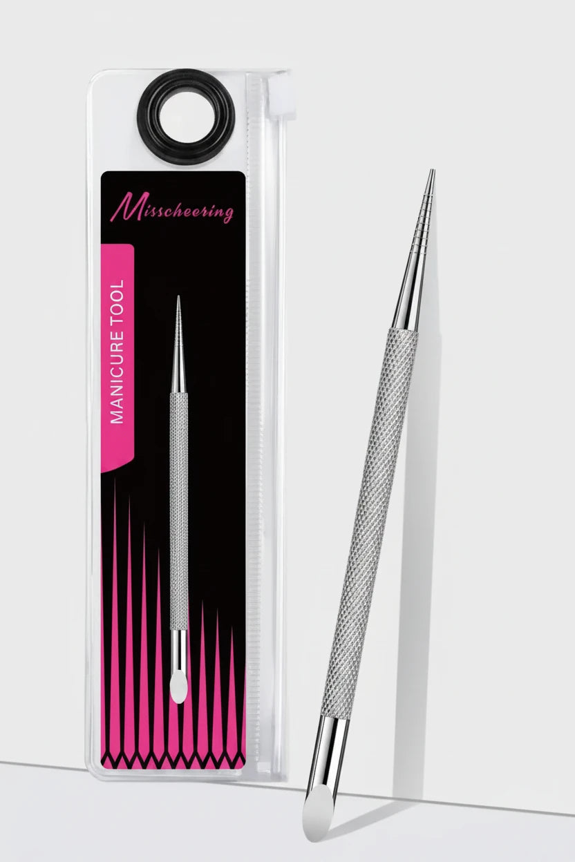 A silver metal manicure tool with a knurled grip and curved tip, shown next to its clear plastic packaging card featuring a black and pink design with the brand name 'Misschoering'.