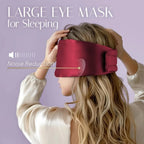 Person wearing a large silk eye mask for sleeping with noise reduction feature on a purple background