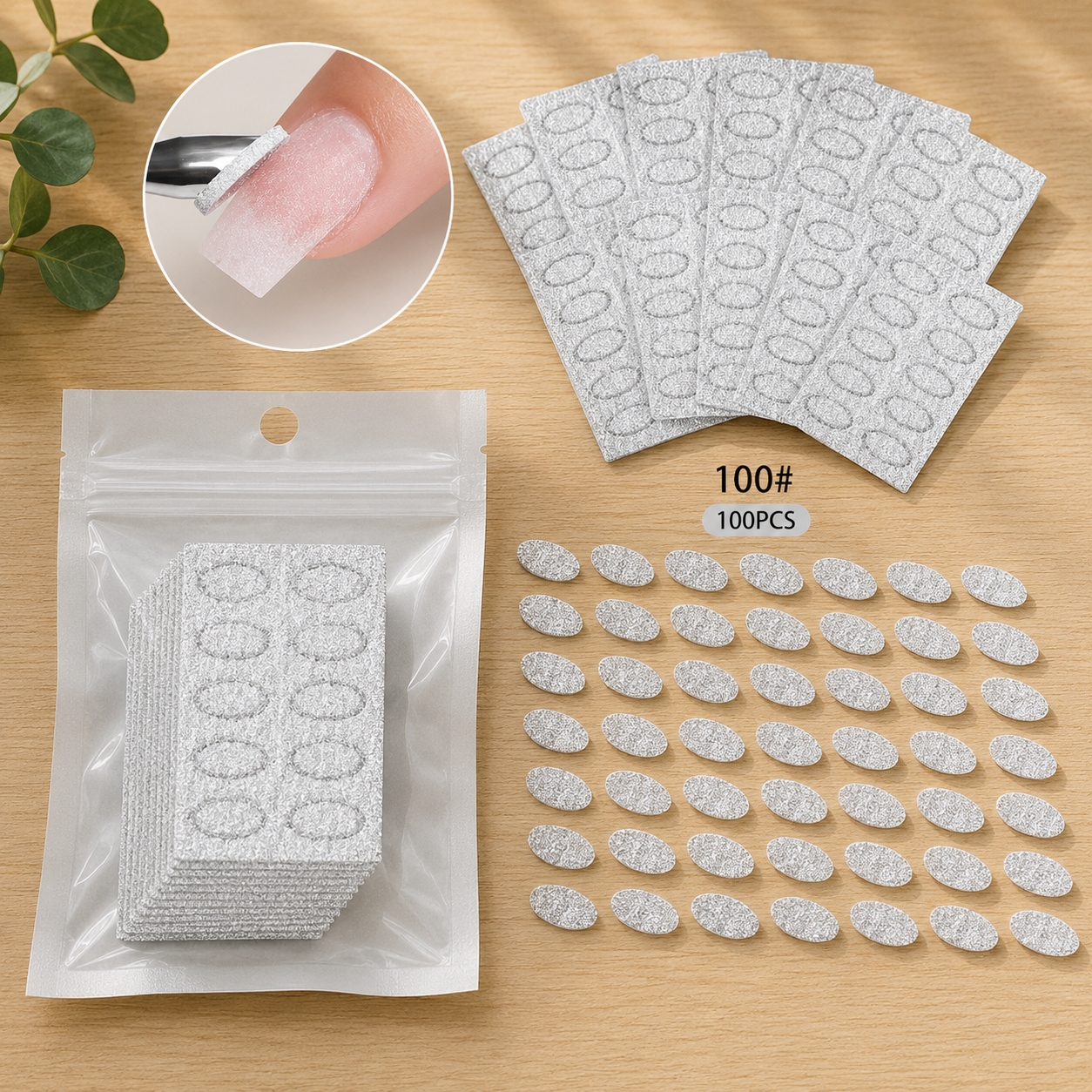 100 pieces of 10# white nail file emery paper sheets, shown both in a clear plastic packaging bag and arranged flat on a light wood surface, with a circular inset showing the file being used on a fingernail.