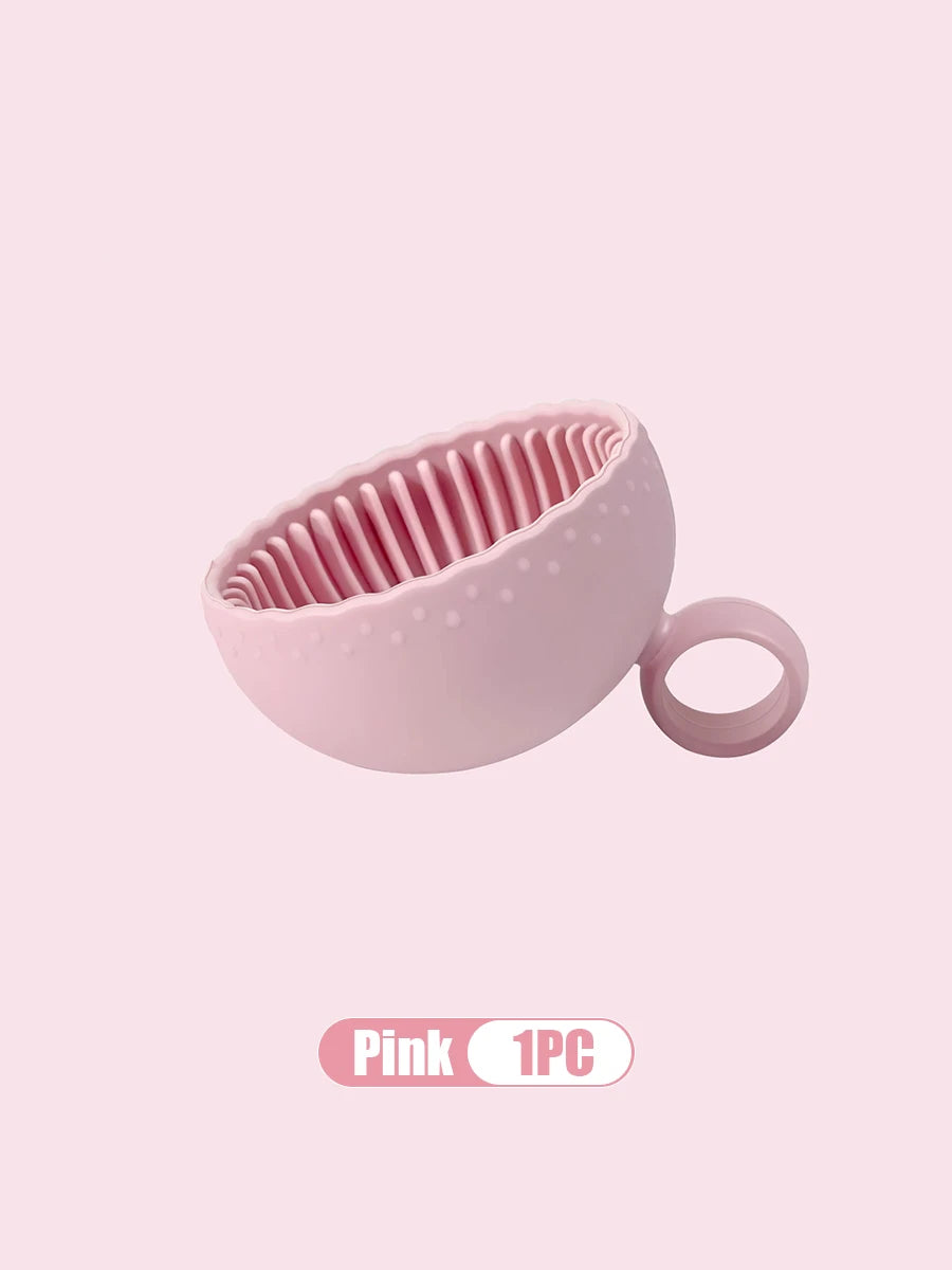 Pink Silicone Makeup brush cleaner on a light pink background