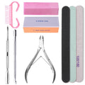 Set of nail care tools including files, brush, and cuticle nipper on a white background