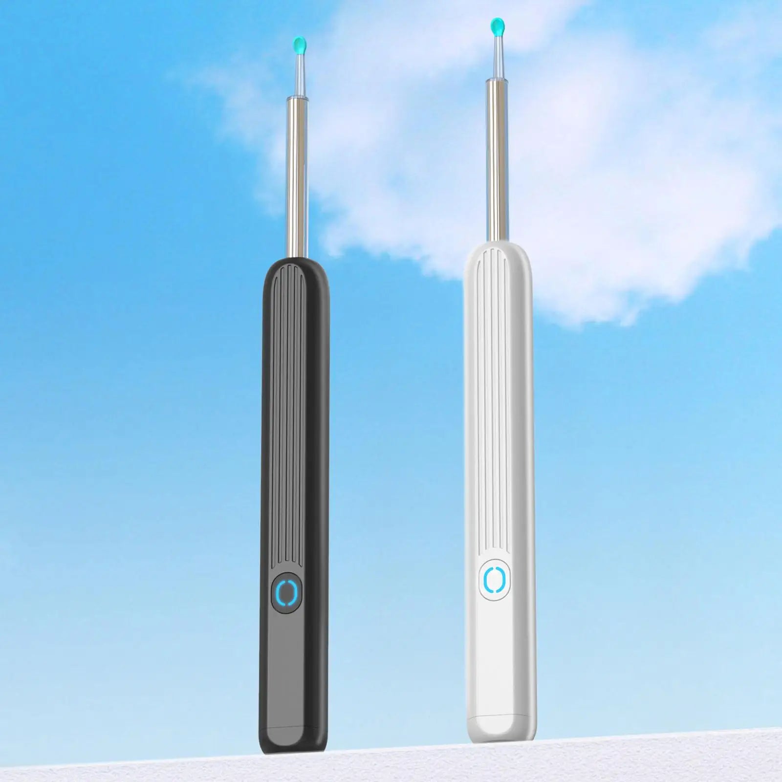 Two dental tools, one black and one white, against a blue sky background.