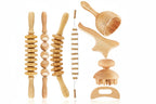 Set of wooden massage tools with various textures on a white background
