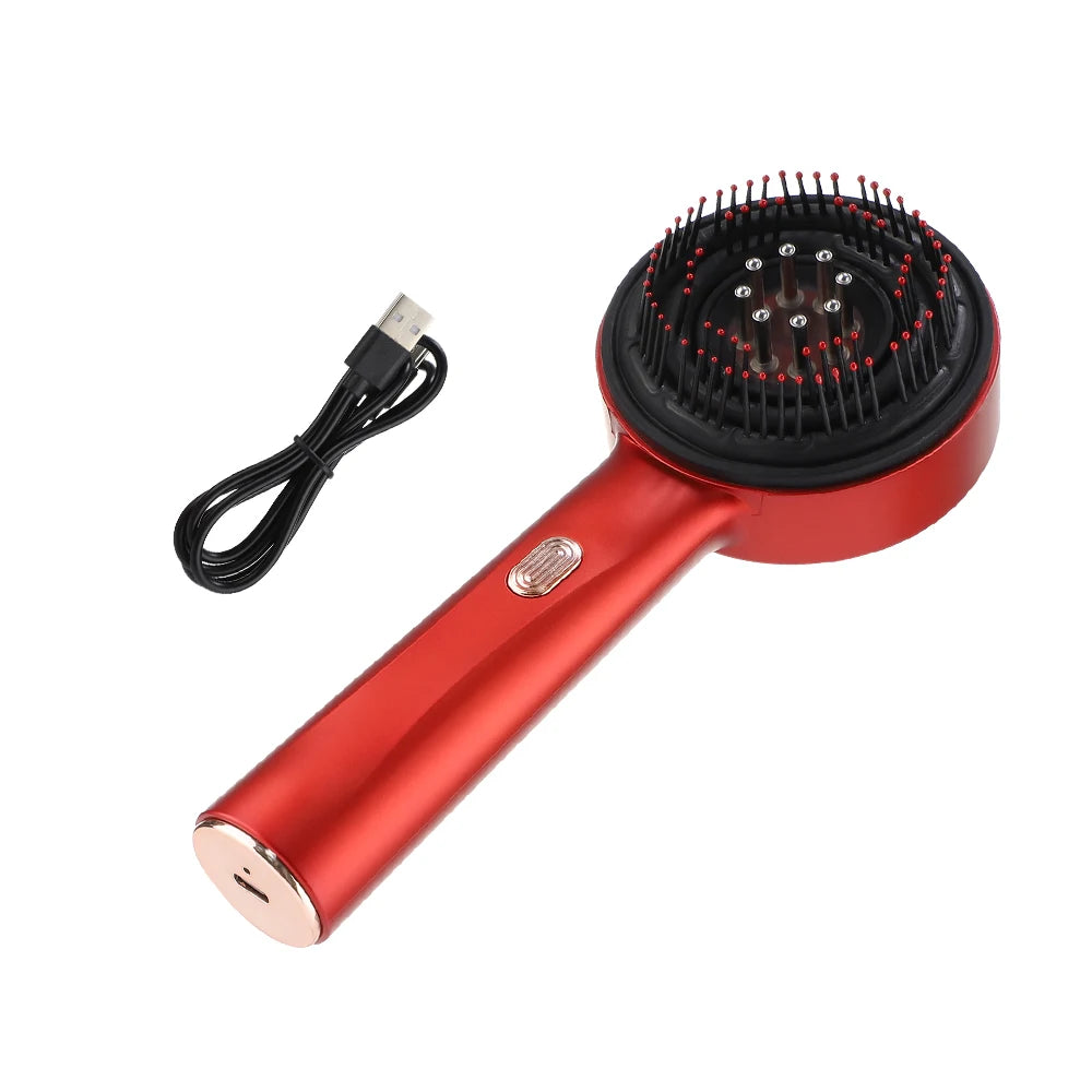 Red hair steamer massage brush  and USB cable on a white background